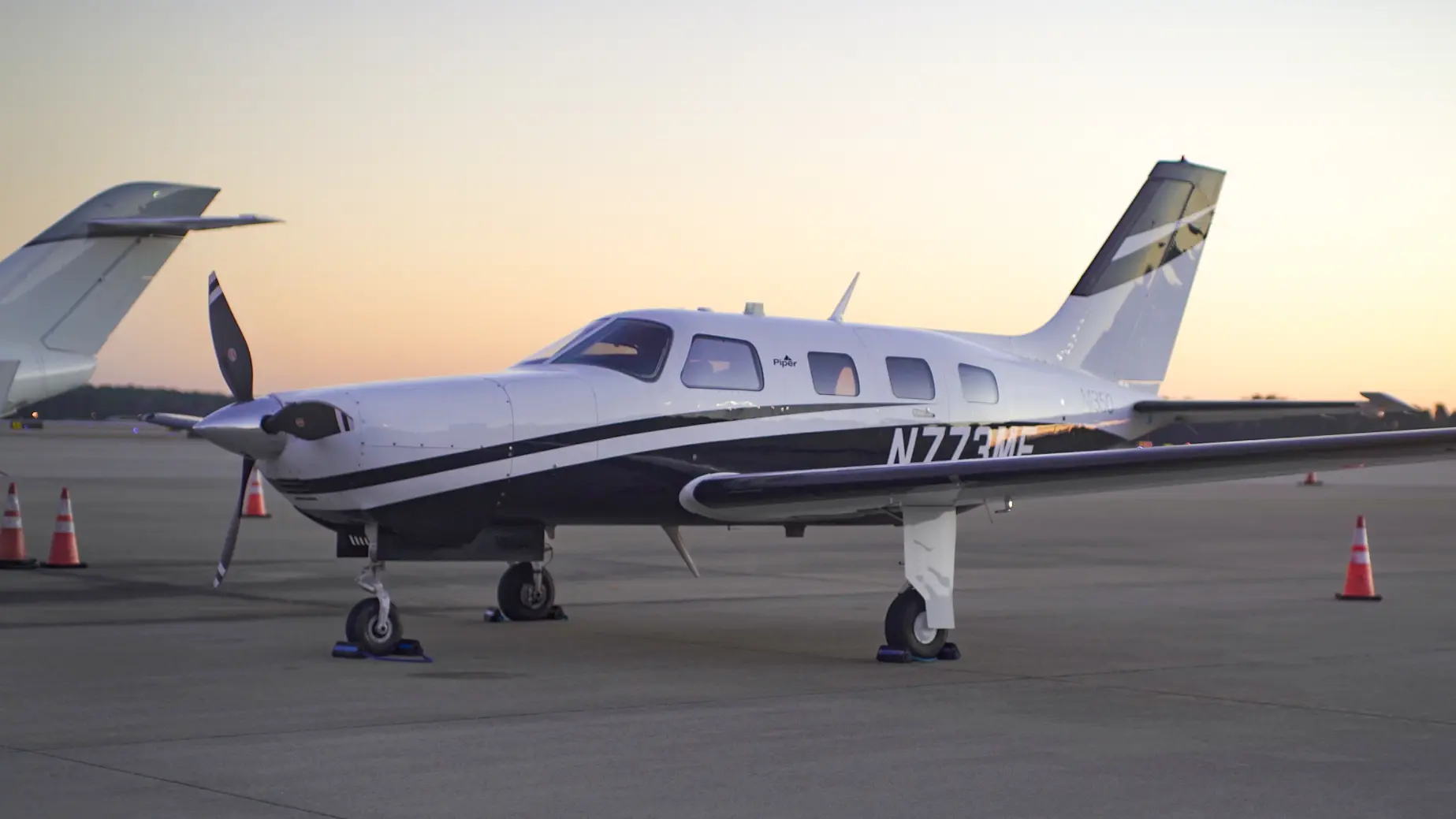 Piper M350 Malibu Mirage on ramp at sunset at RDU International Airport